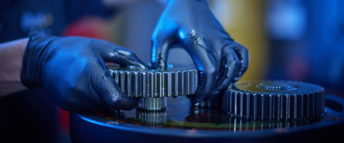 Gears being assembled by a Plant Parts Ltd employee wearing gloves
